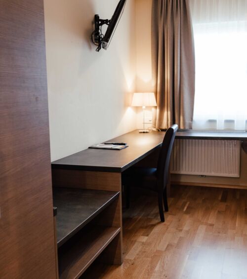 Large built-in wardrobe and desk in the twin room of the Landgasthof Kirchbichl